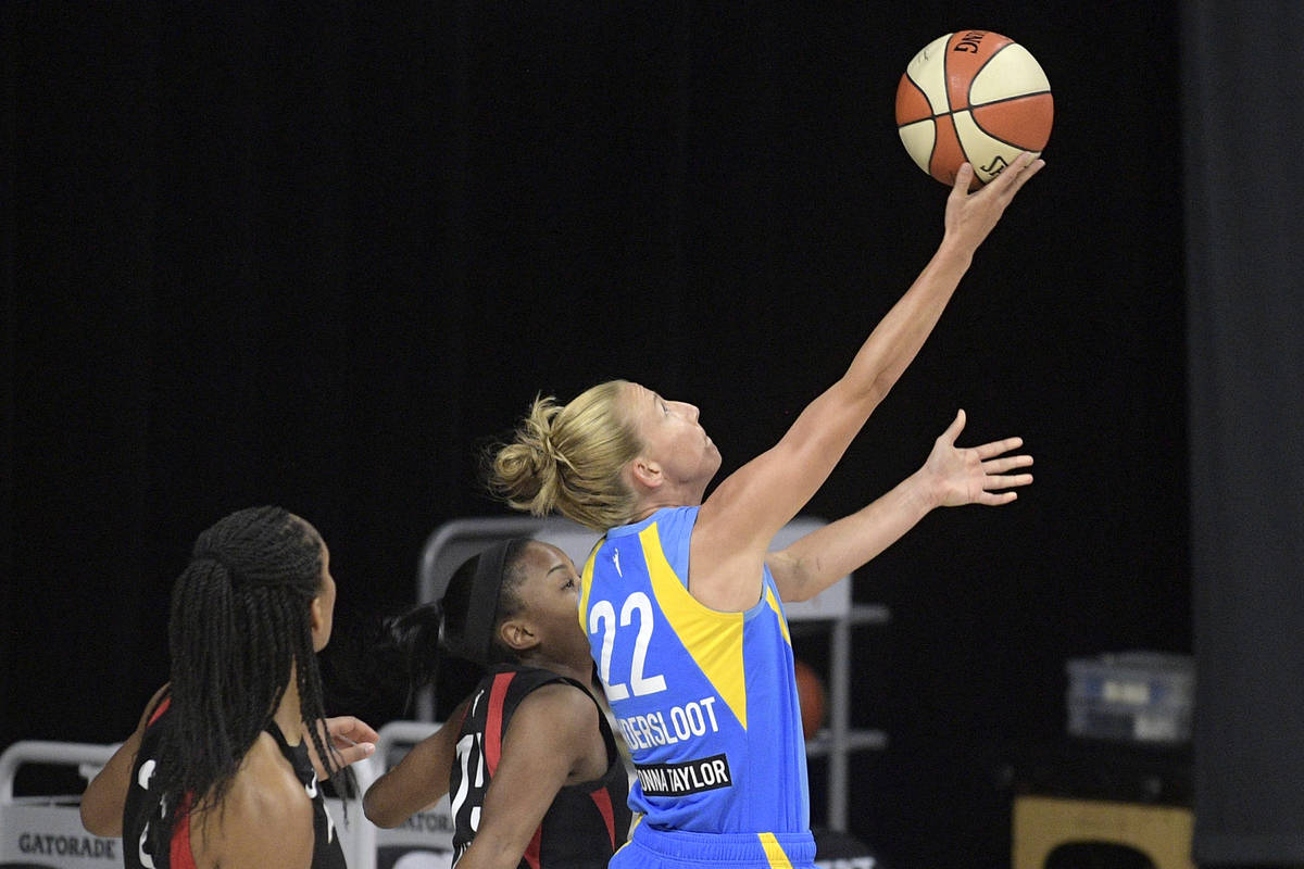 Chicago Sky guard Courtney Vandersloot (22) goes up for a shot in front of Las Vegas Aces cente ...