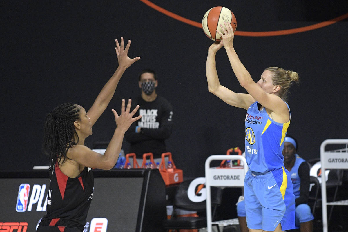 Chicago Sky guard Allie Quigley, right, goes up for a shot in front of Las Vegas Aces center A' ...