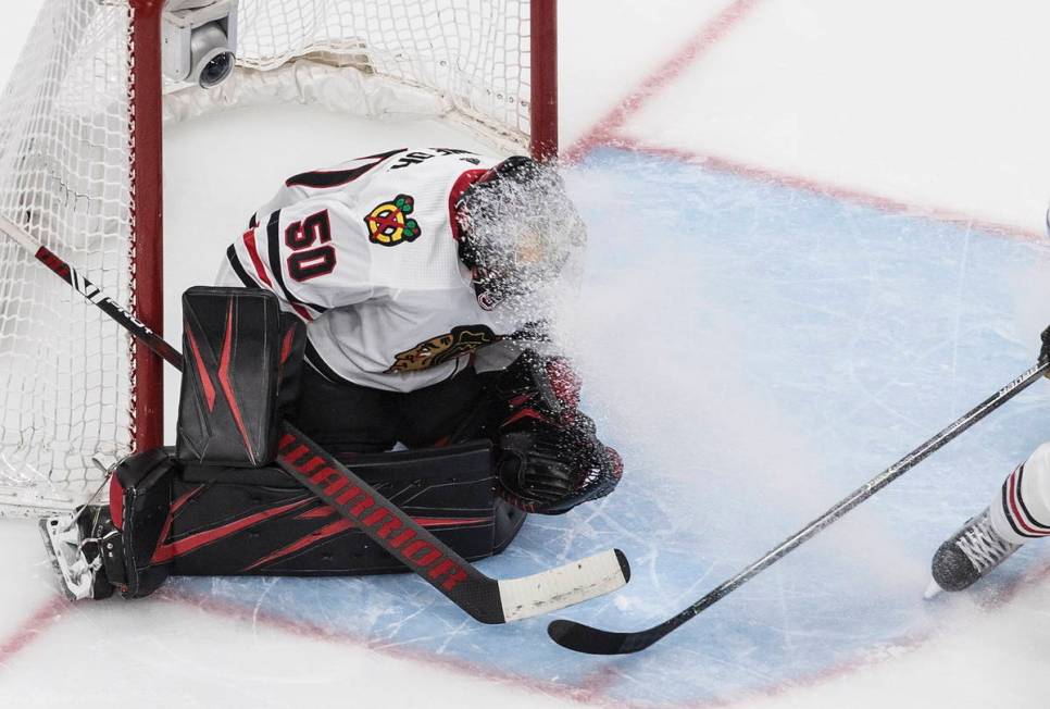 Chicago Blackhawks goalie Corey Crawford is sprayed with ice shavings during the second period ...