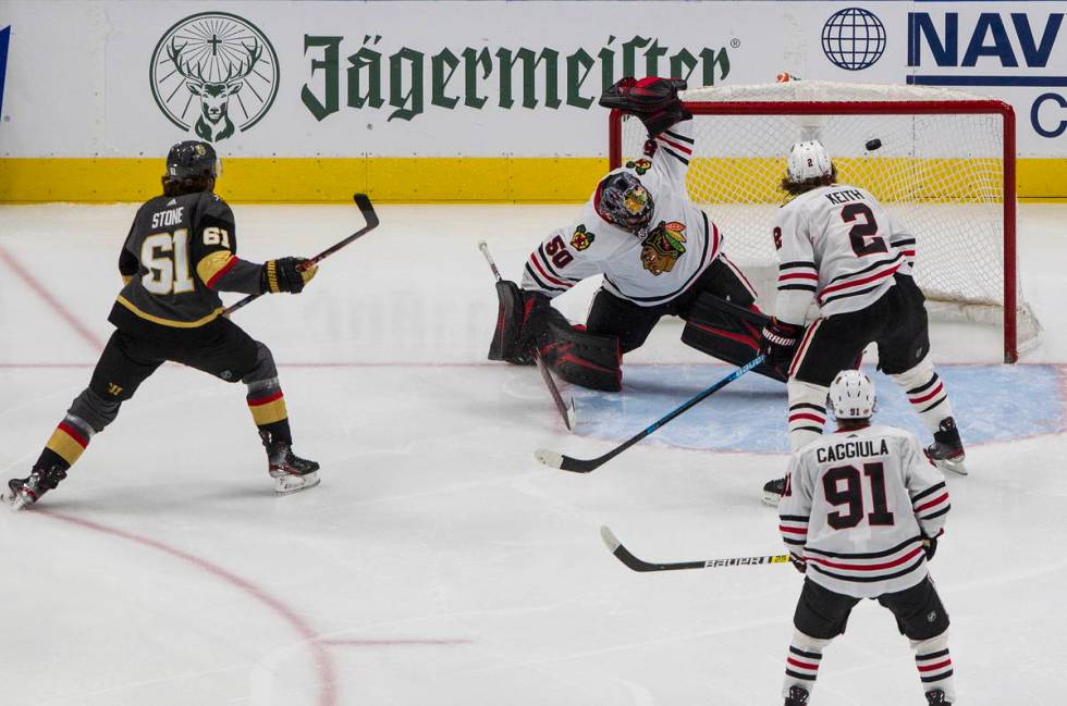 Vegas Golden Knights' Mark Stone (61) scores on Chicago Blackhawks goalie Corey Crawford (50) a ...