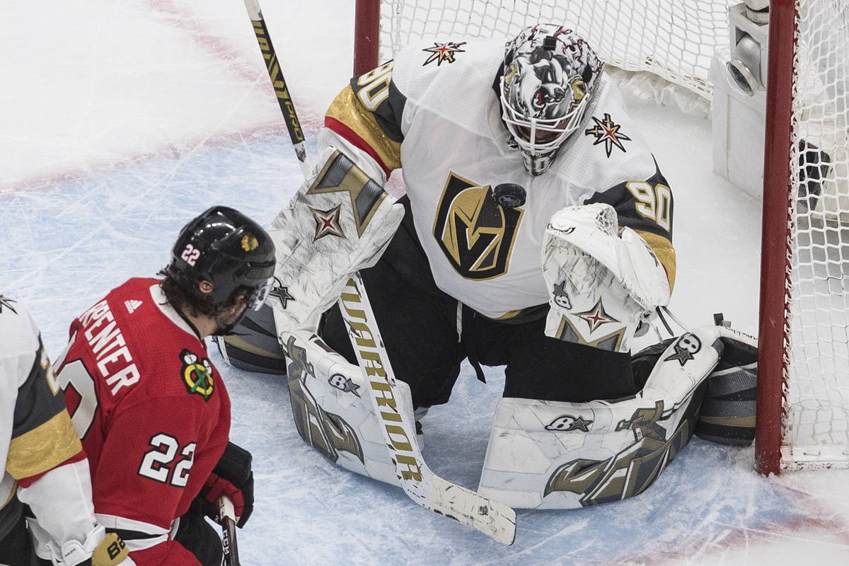 Vegas Golden Knights goalie Robin Lehner (90) makes a save on Chicago Blackhawks' Ryan Carpente ...