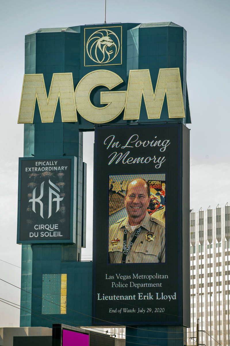 The marquee at the MGM honors Las Vegas police Lt. Erik Lloyd as his funeral procession moves d ...