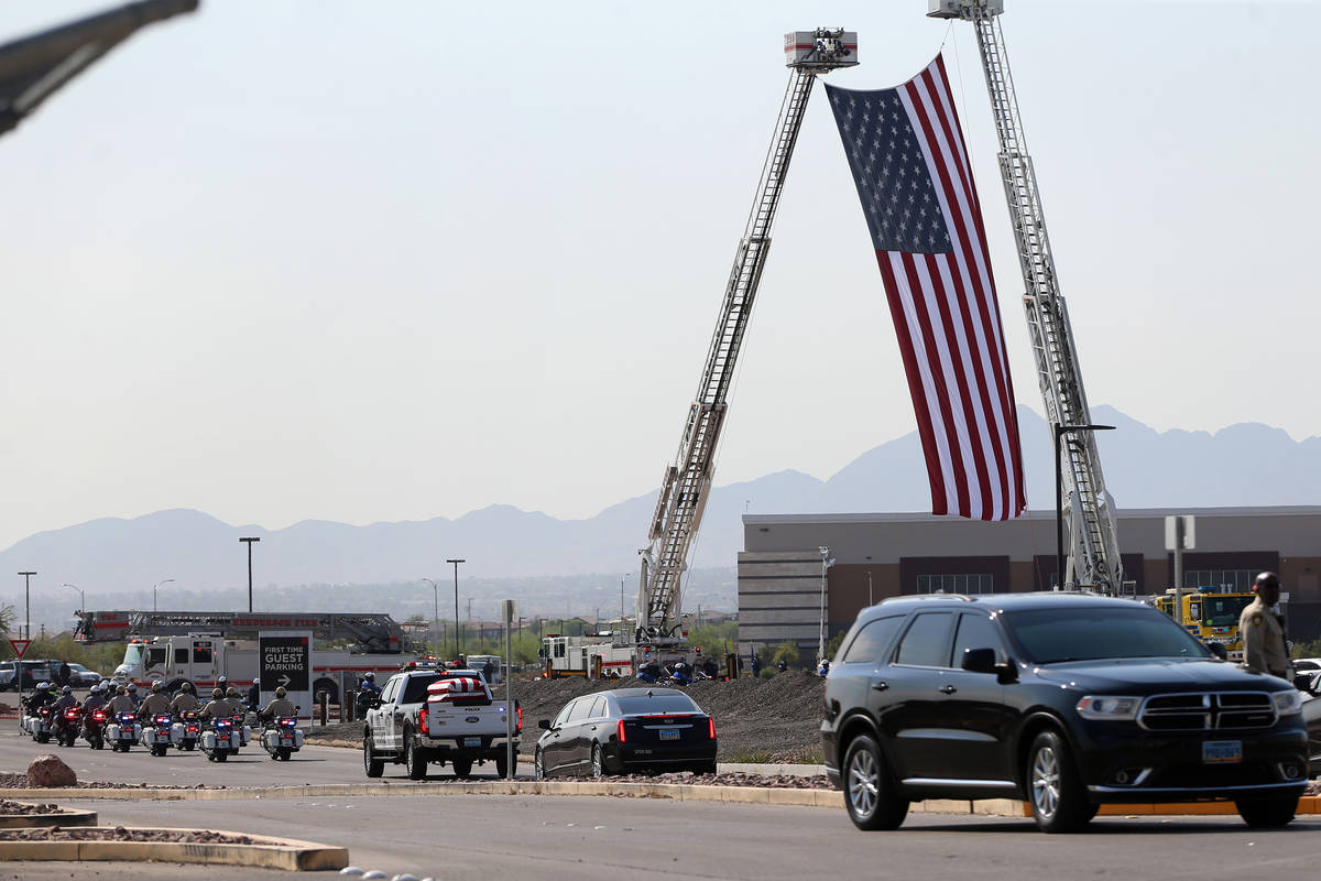 The funeral procession for Lt. Erik Lloyd arrives at Central Christian Church in Henderson, Wed ...