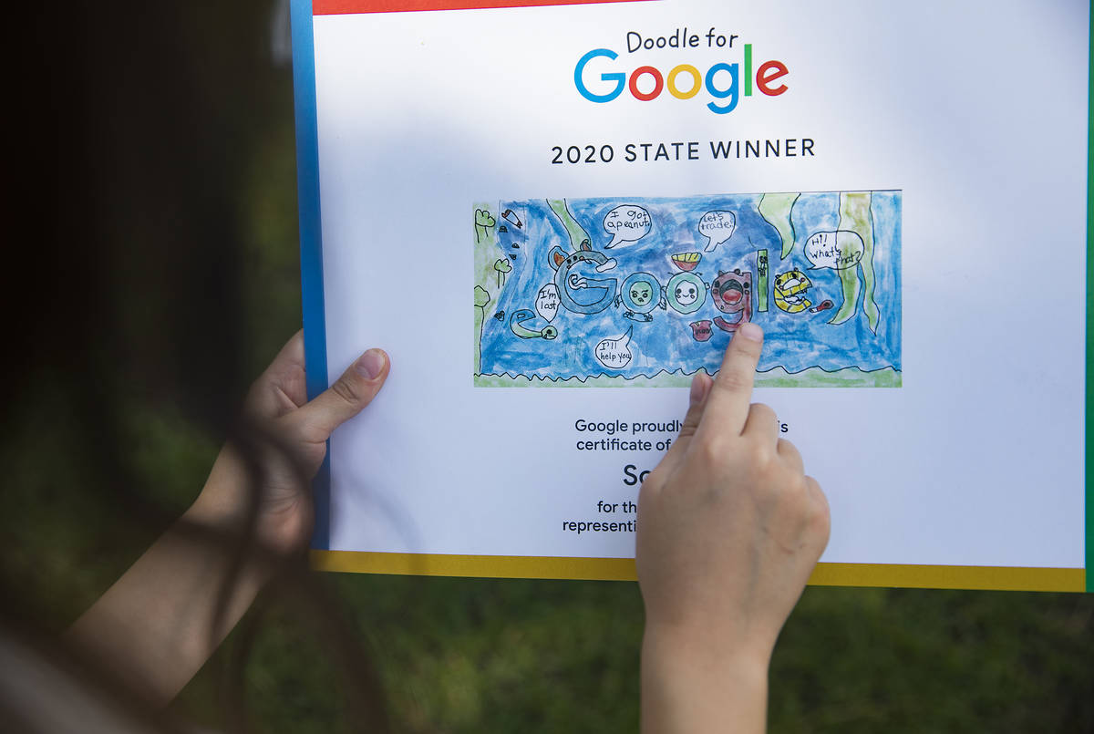 Sofia Hall, 8, points out details of her Doodle for Google at her home in Las Vegas, Wednesday ...