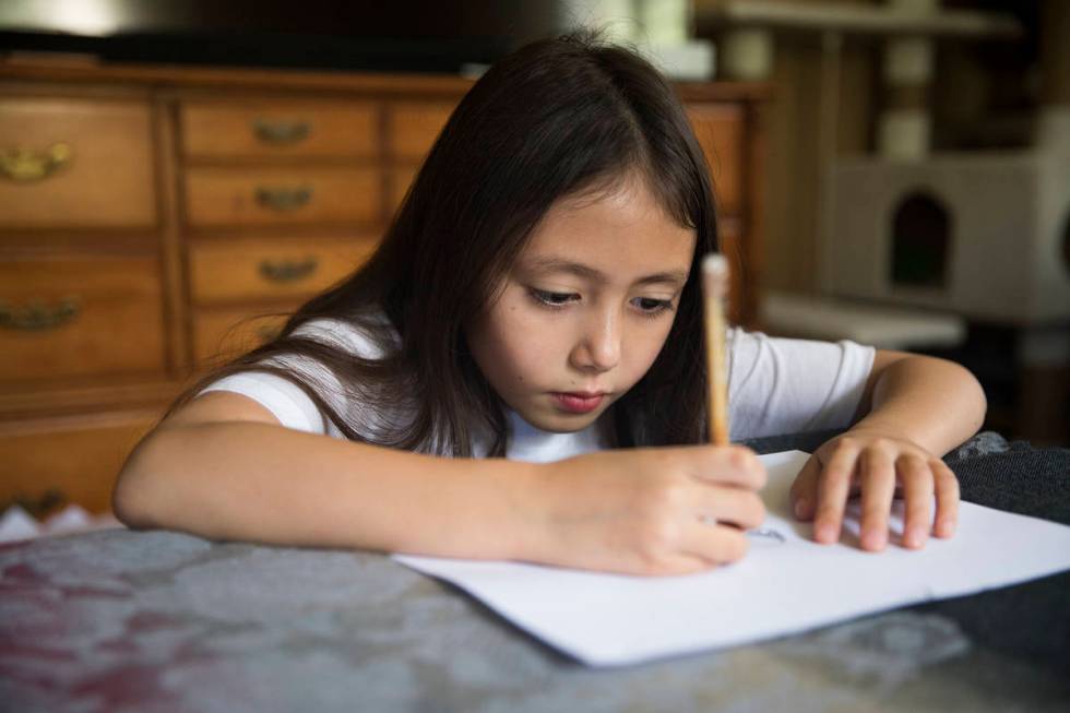 Sofia Hall, 8, draws at her home in Las Vegas, Wednesday, Aug. 19, 2020. Hall is the Nevada win ...