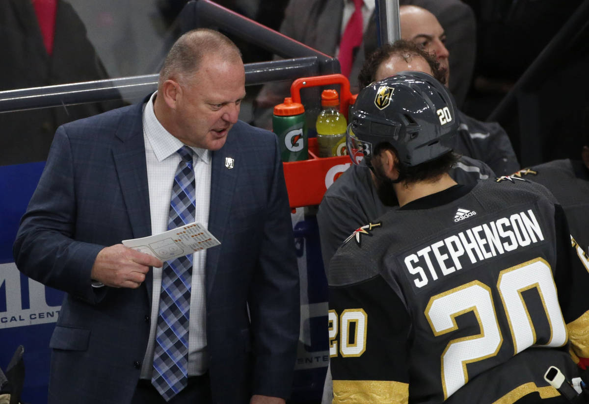 Vegas Golden Knights head coach Gerard Gallant talks to Vegas Golden Knights center Chandler St ...