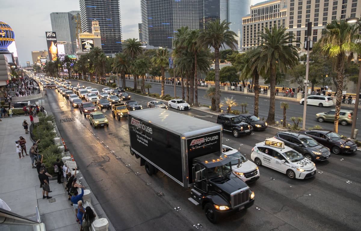 A motorcade of entertainment workers drive south on the Strip during an event to raise awarenes ...