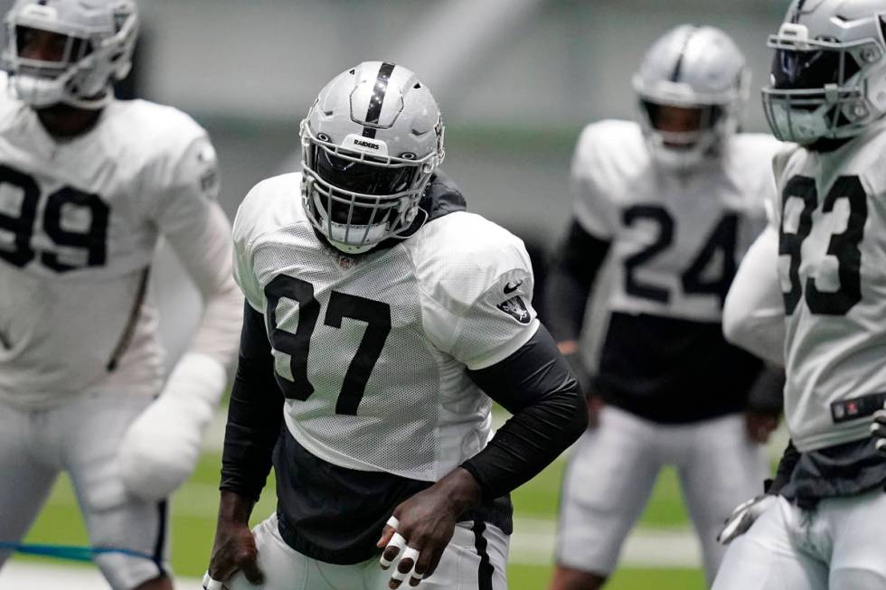 Raiders defensive tackle Maliek Collins (97) warms up during an NFL football training camp prac ...