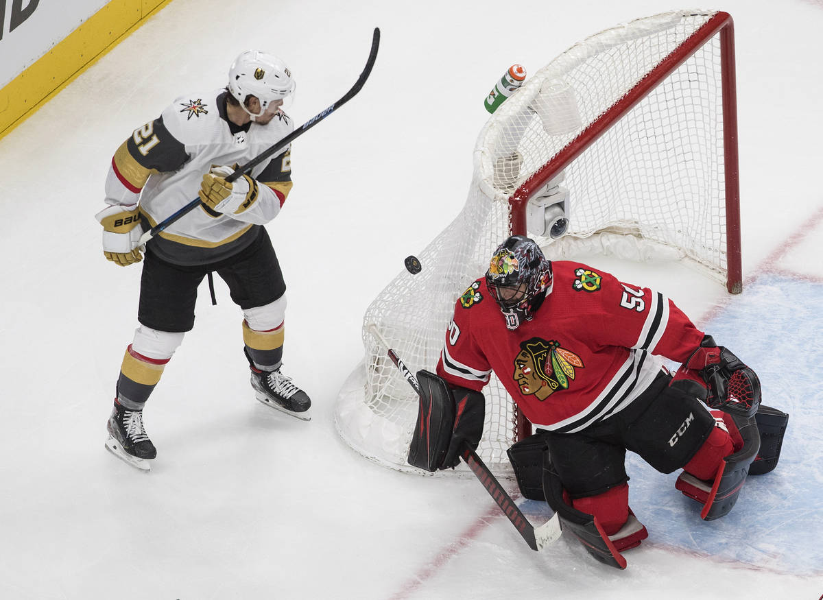 Vegas Golden Knights' Nick Cousins (21) is stopped by Chicago Blackhawks goalie Corey Crawford ...