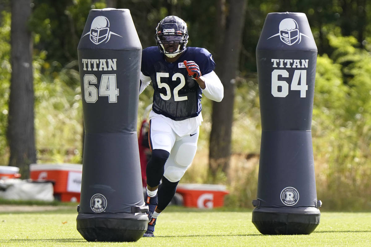 Chicago Bears linebacker Khalil Mack runs a drill during an NFL football camp practice in Lake ...