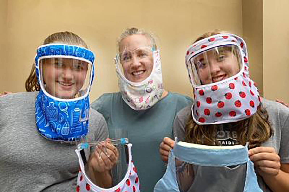 Shannon O'Toole (center) and daughters Tierney and Sage Morton model the ShanShiled face coveri ...