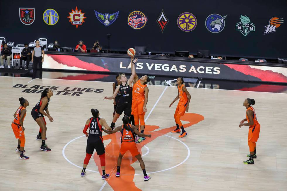 The Connecticut Sun and the Las Vegas Aces go for the tipoff during the first half of a WNBA ba ...