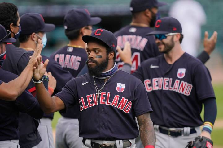 Cleveland Indians center fielder Delino DeShields greets teammates after their 8-5 over the Det ...