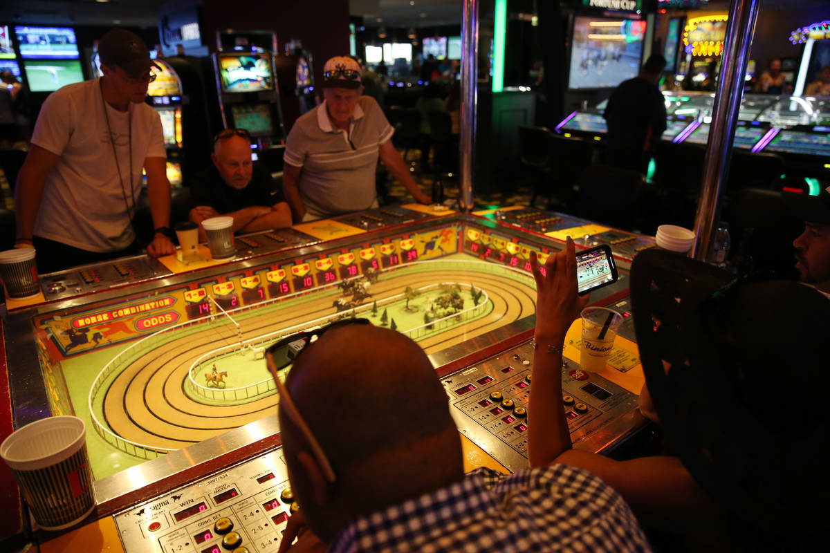 People play the Sigma Derby machine at the D Las Vegas hotel-casino in Las Vegas, Friday, Aug. ...