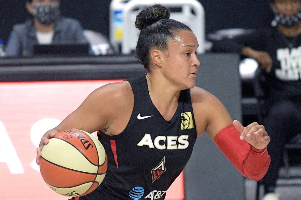 Las Vegas Aces guard Kayla McBride (21) drives to the lane against Chicago Sky guard Allie Quig ...