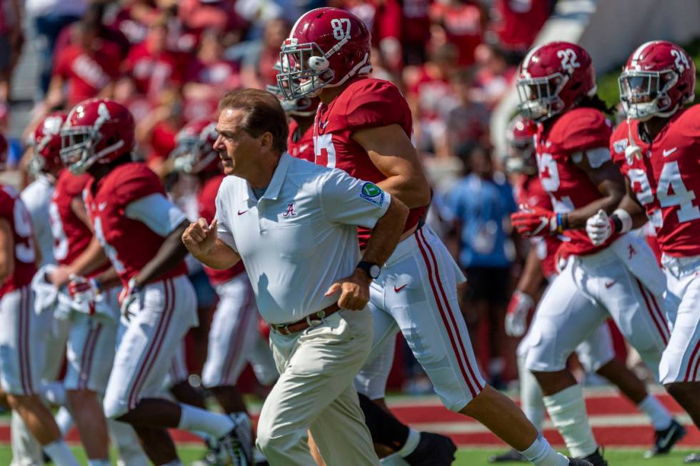 FILE - In this Sept. 28. 2019, file photo, Alabama coach Nick Saban leads the team onto the fie ...