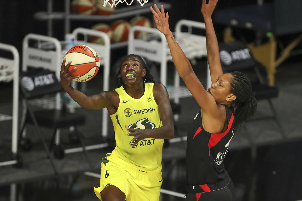 Seattle Storm's Natasha Howard (6) shoots against Las Vegas Aces' A'ja Wilson during the first ...