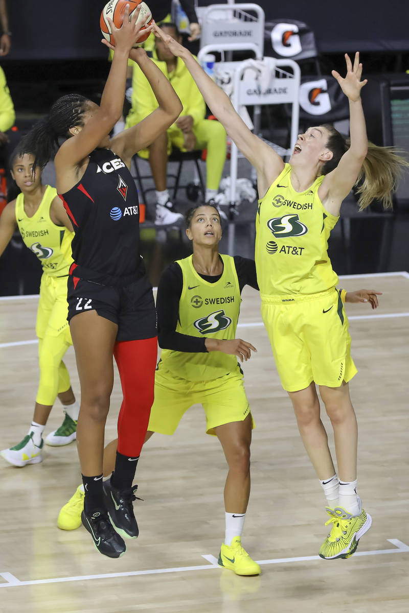 Las Vegas Aces' A'ja Wilson has her shot blocked by Seattle Storm's Breanna Stewart during the ...