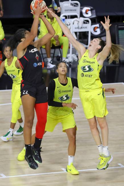 Las Vegas Aces' A'ja Wilson has her shot blocked by Seattle Storm's Breanna Stewart during the ...