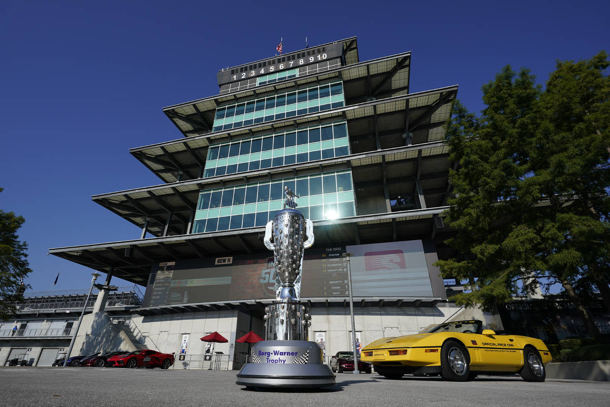 The Borg-Warner Trophy complete with a checkered flag mask, is displayed outside of the Pagoda ...