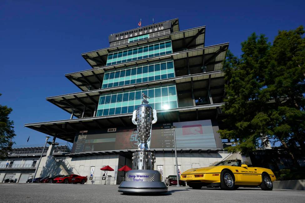 The Borg-Warner Trophy complete with a checkered flag mask, is displayed outside of the Pagoda ...