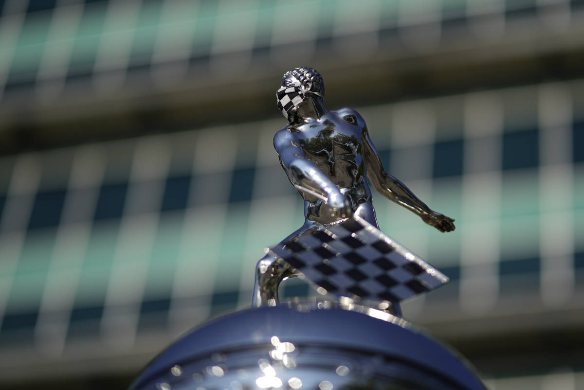 The top Borg-Warner Trophy complete with a checkered flag mask, is displayed outside of the Pag ...