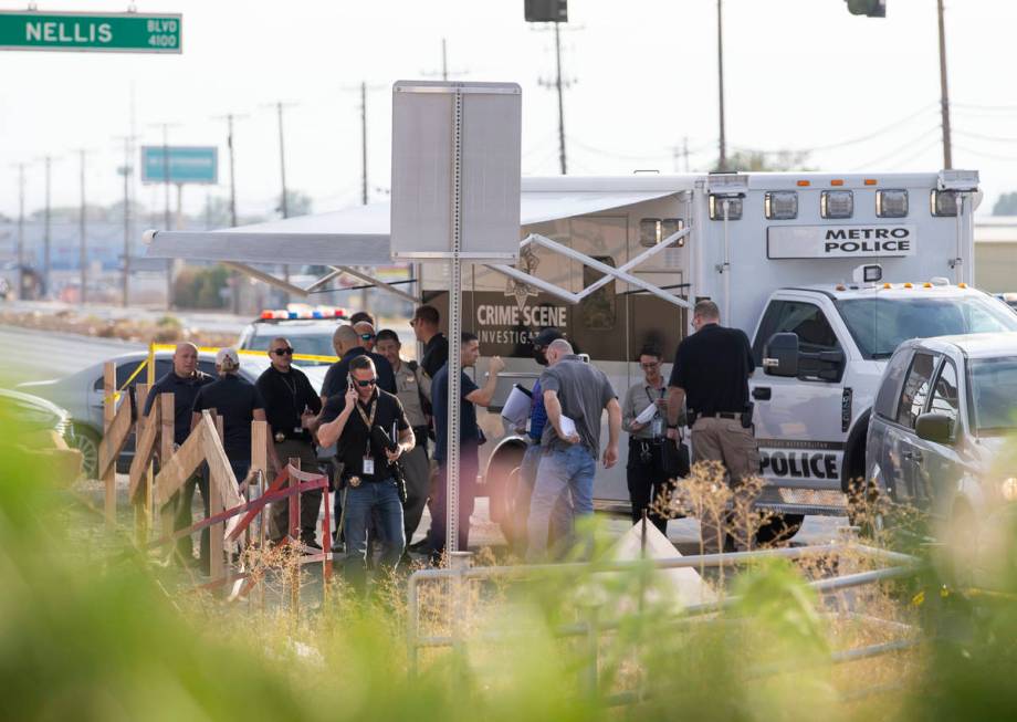 Metropolitan police investigate a homicide near the intersection of North Las Vegas Boulevard a ...