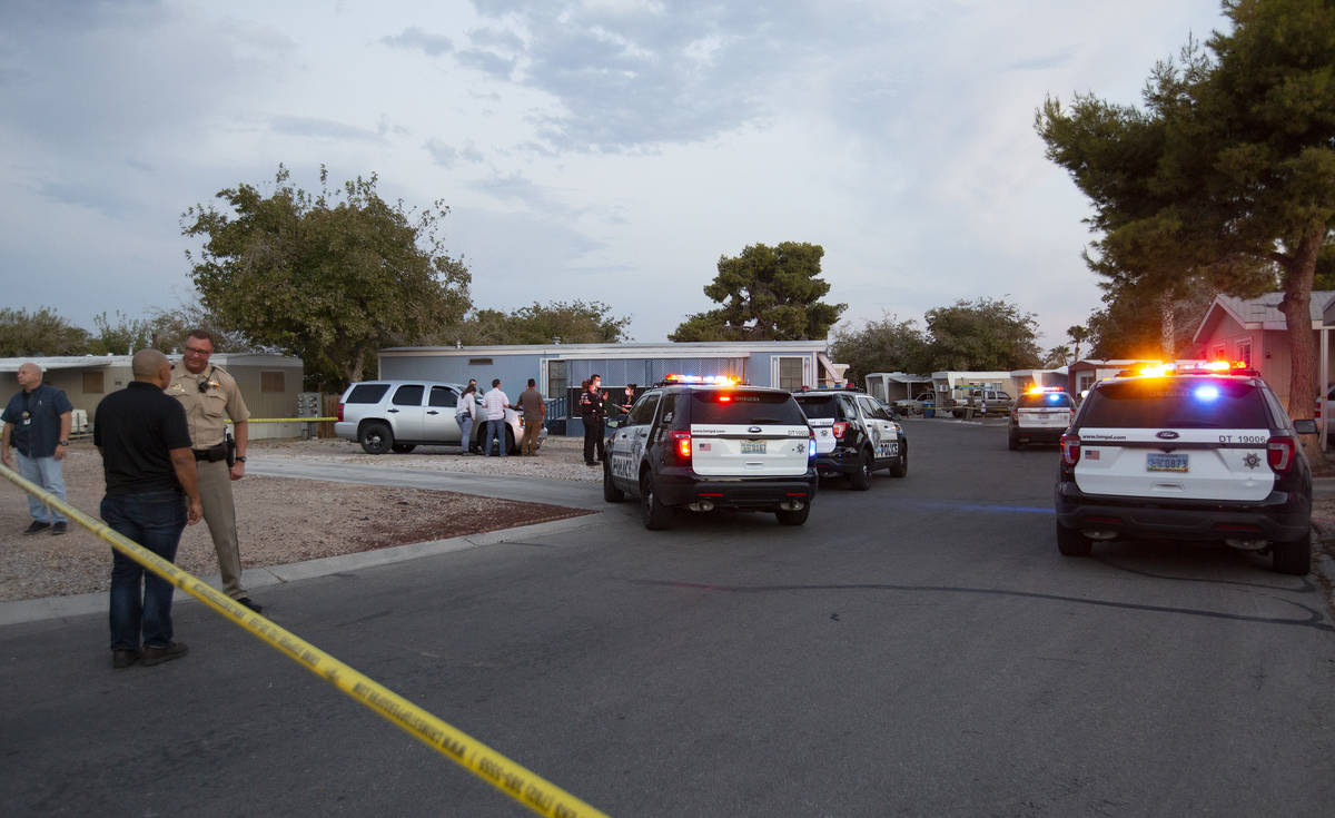 Metropolitan police investigate a homicide near the 2000 block of Palm Street, at the Riviera M ...