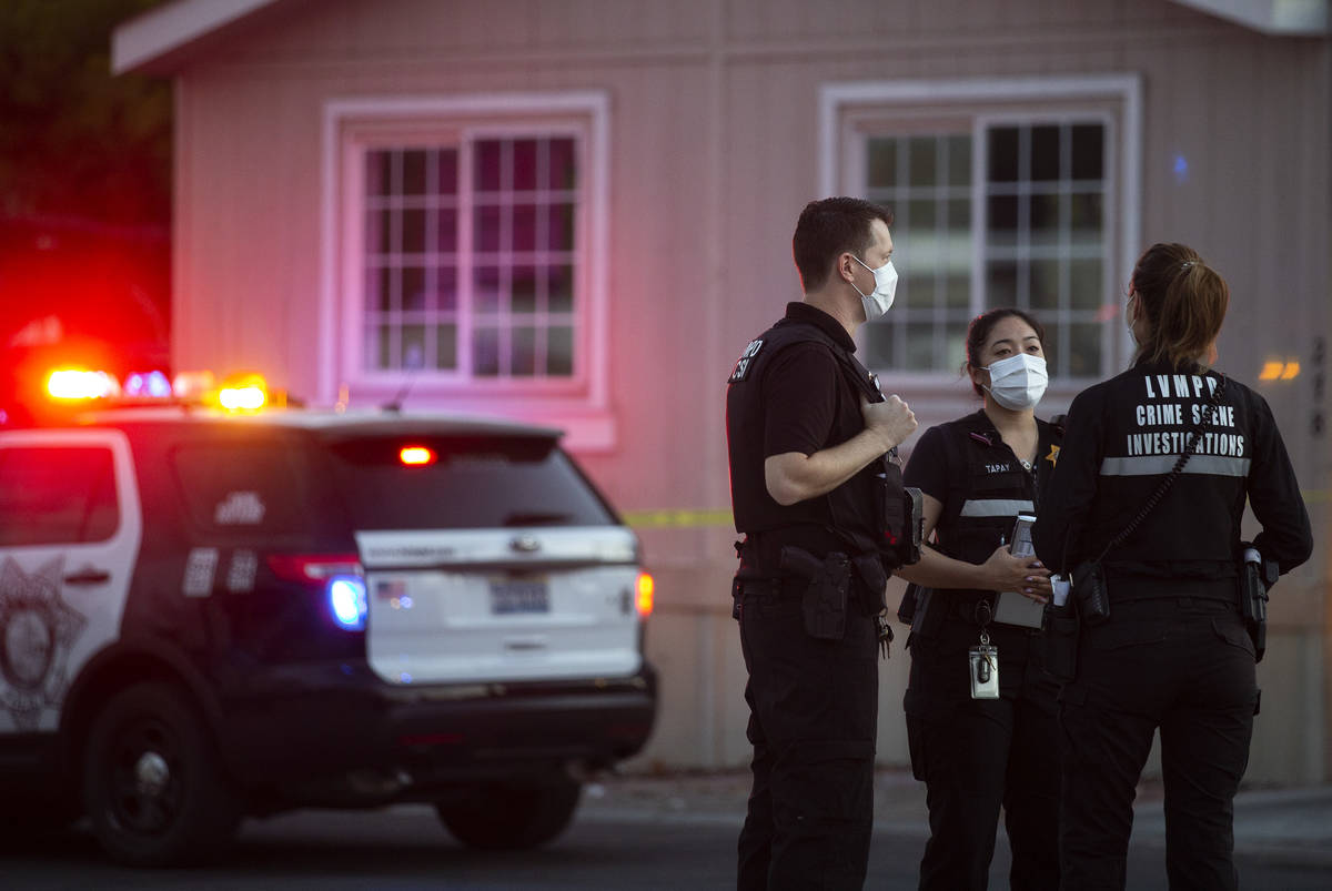 Metropolitan police investigate a homicide near the 2000 block of Palm Street, at the Riviera M ...