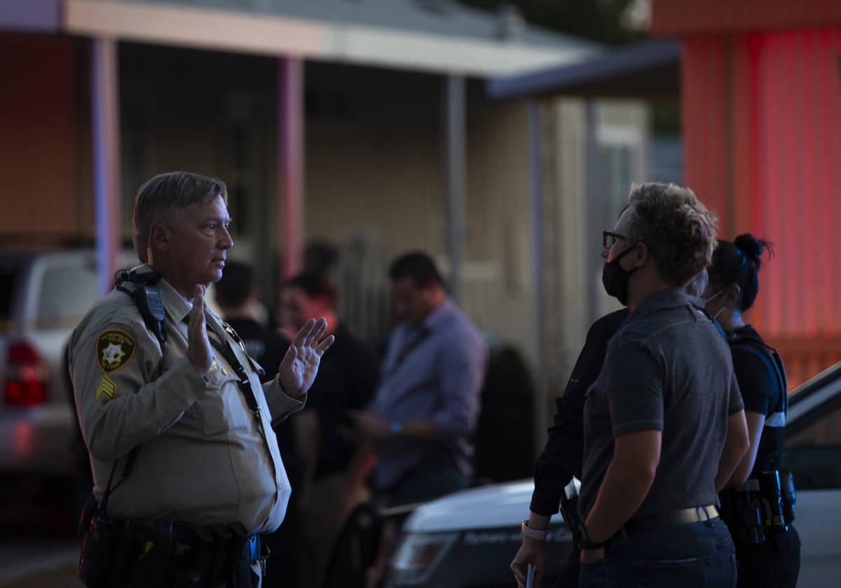 Metropolitan police investigate a homicide near the 2000 block of Palm Street, at the Riviera M ...