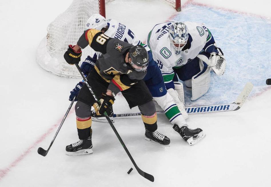 Vegas Golden Knights' Reilly Smith (19) is stopped by Vancouver Canucks goalie Jacob Markstrom ...