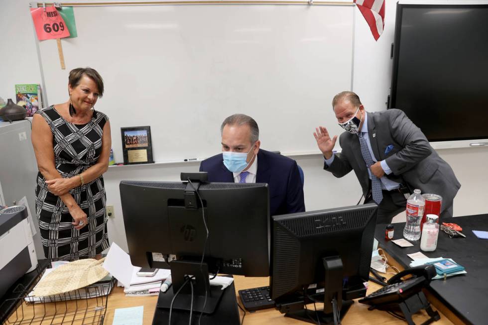 Clark County School District Superintendent Jesus Jara, center, greets distance learning studen ...