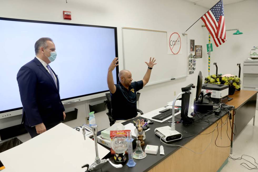 Clark County School District Superintendent Jesus Jara, left, greets distance learning students ...