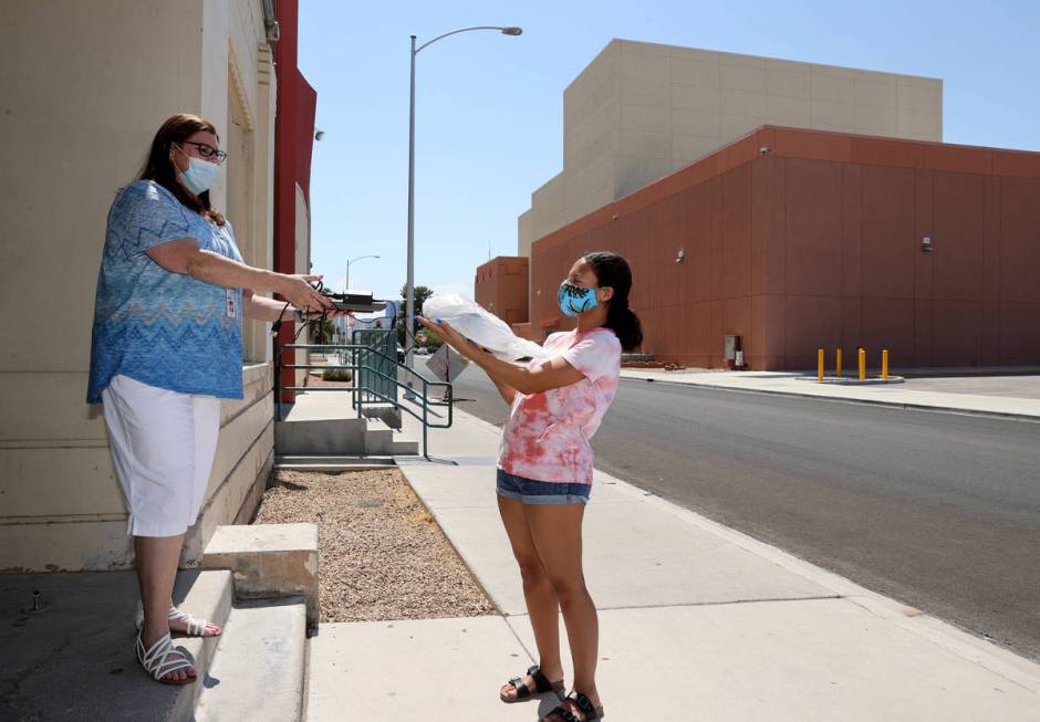 Las Vegas Academy senior Leilani Piris exchanges her Chromebook for one with a working camera f ...