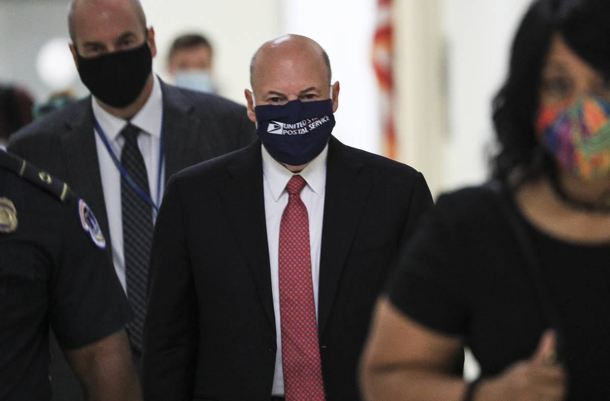 Postmaster General Louis DeJoy arrives to testify before a House Oversight and Reform Committee ...