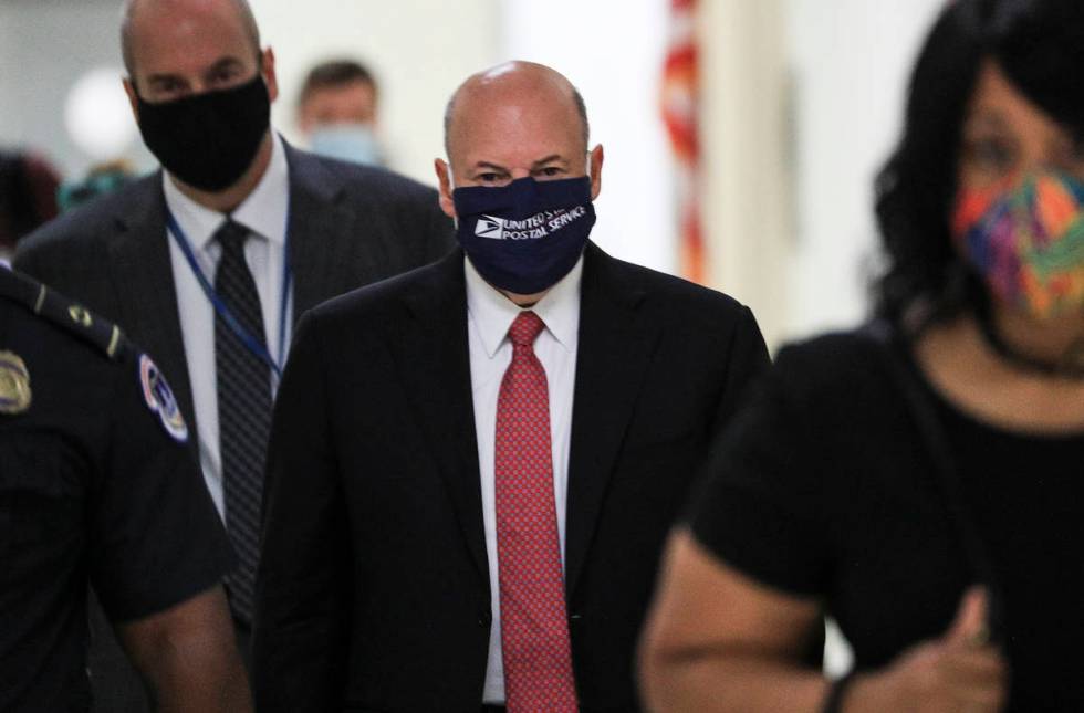 Postmaster General Louis DeJoy arrives to testify before a House Oversight and Reform Committee ...