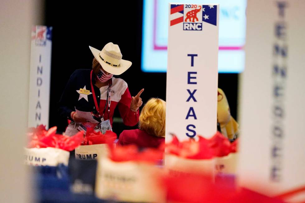 The room is set and delegates begin to arrive for the first day of the Republican National Conv ...