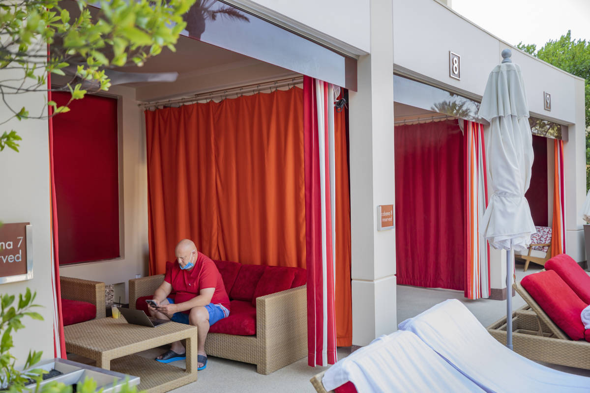 Jonathan Taylor of California works remotely in a cabana at Red Rock resort-casino on Wednesday ...