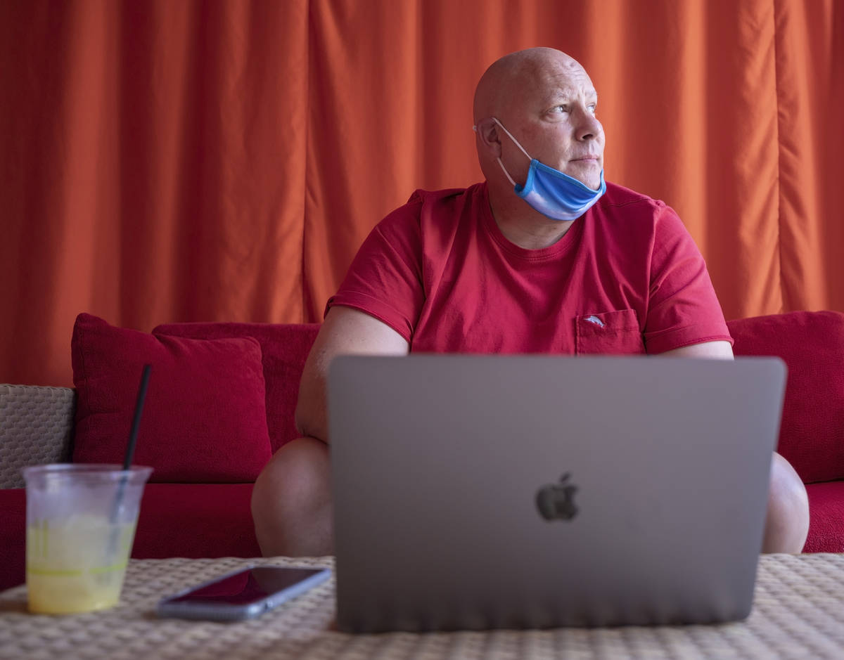 Jonathan Taylor of California works remotely in a cabana at Red Rock resort-casino on Wednesday ...