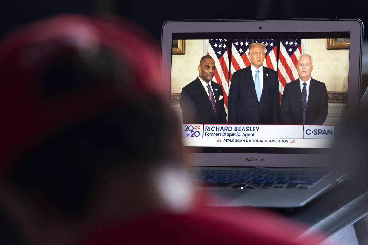 An attendee watches the Republican National Convention on Tuesday, Aug. 25, 2020, at the Trump ...