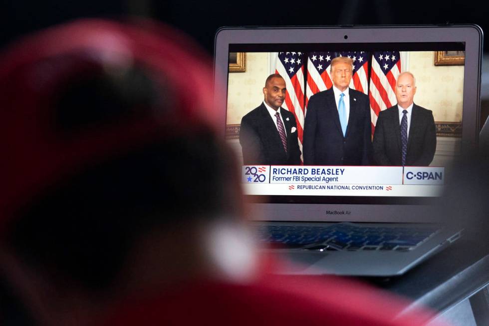 An attendee watches the Republican National Convention on Tuesday, Aug. 25, 2020, at the Trump ...