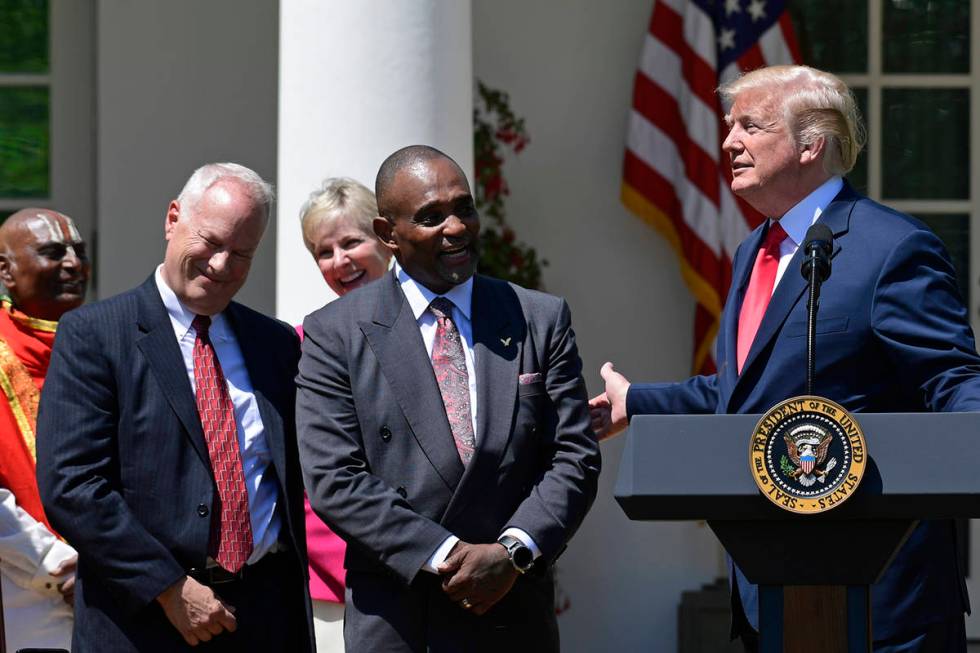 President Donald Trump, right, talks about Jon Ponder, second from right, from Las Vegas, and F ...