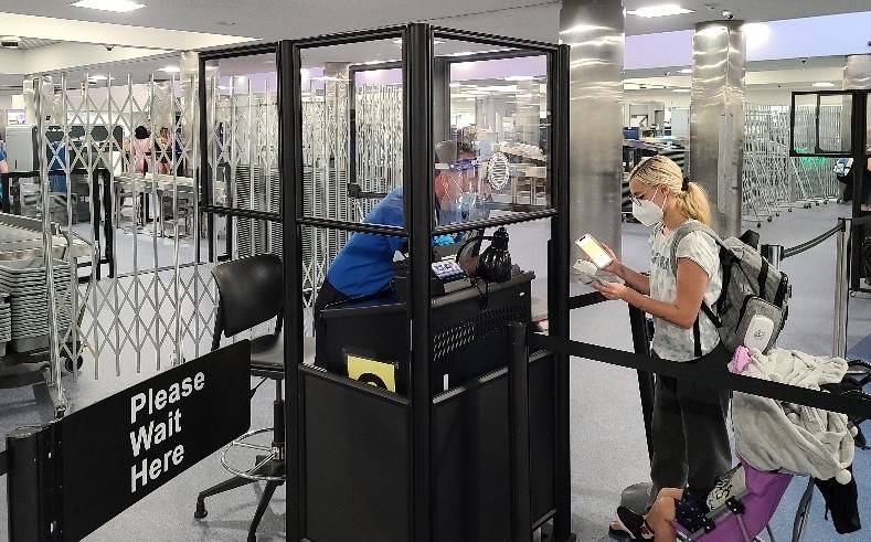 Acrylic barriers have been installed in security checkpoints at McCarran International Airport ...