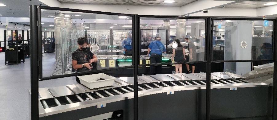 Acrylic barriers have been installed in security checkpoints at McCarran International Airport ...