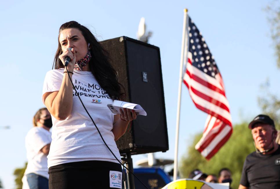 Charlie Melvin, director of public relations for Power2Parent, speaks during a demonstration in ...