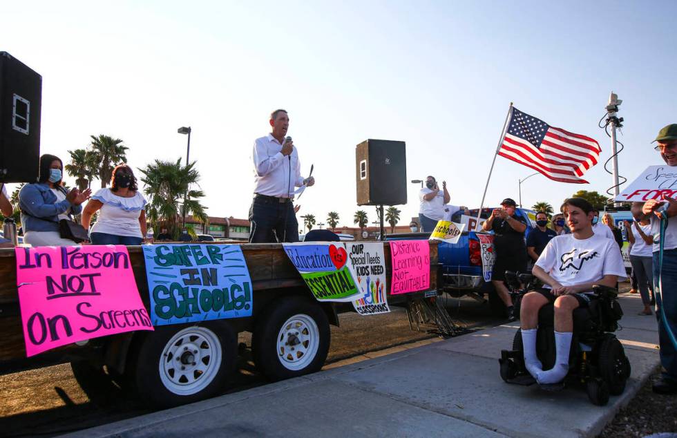 State Sen. Scott Hammond, R-Las Vegas, speaks during a demonstration in support of reopening pu ...