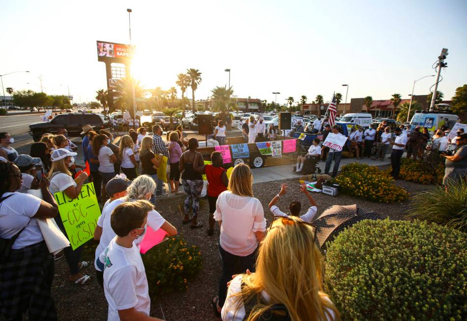 Attendees listen as Erin Phillips, president of Power2Parent, speaks during a demonstration in ...