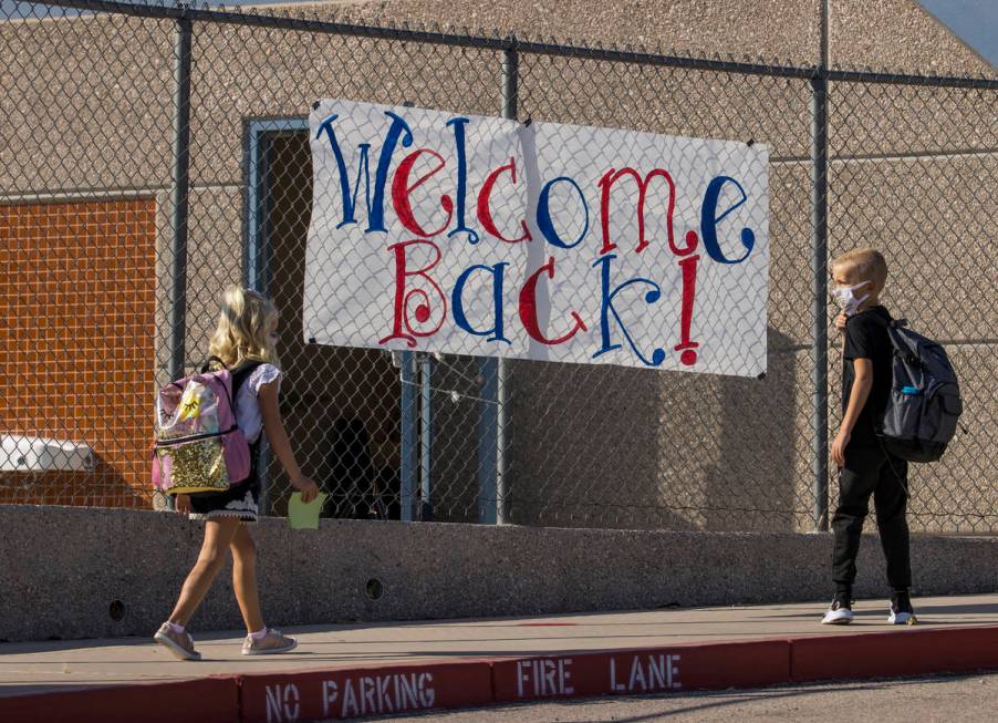 A sign signals the opening day of class for students at Ute Perkins Elementary School having be ...