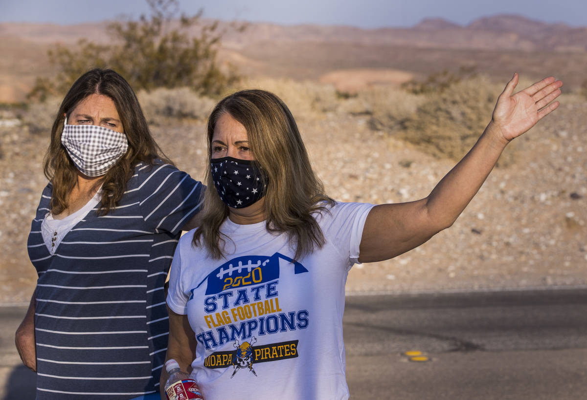 Moapa Valley High School parents Teresa Holzer, right, and Tami Clove talk about the return of ...