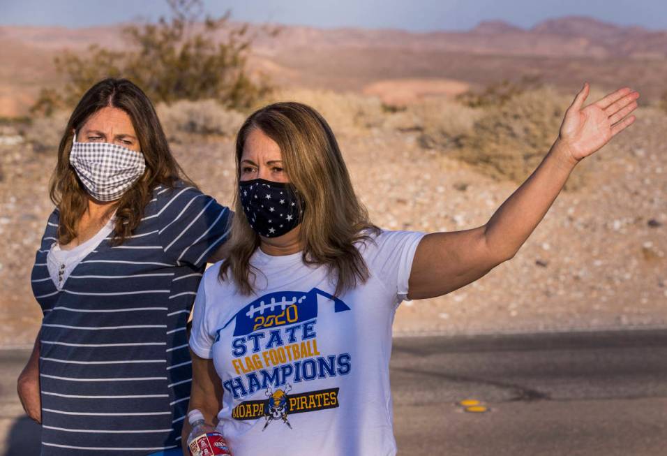 Moapa Valley High School parents Teresa Holzer, right, and Tami Clove talk about the return of ...